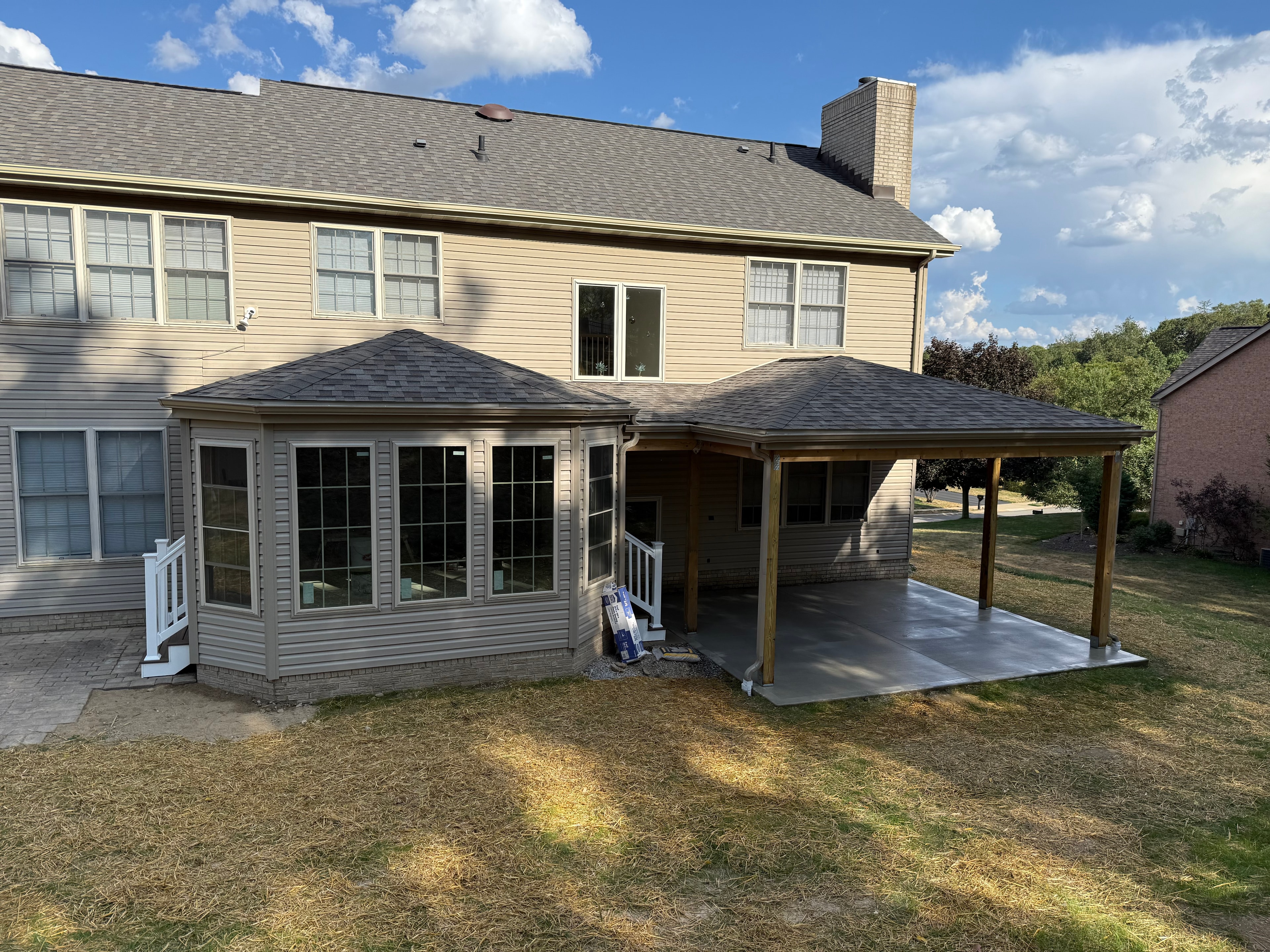 Sunroom addition with covered patio exterior view